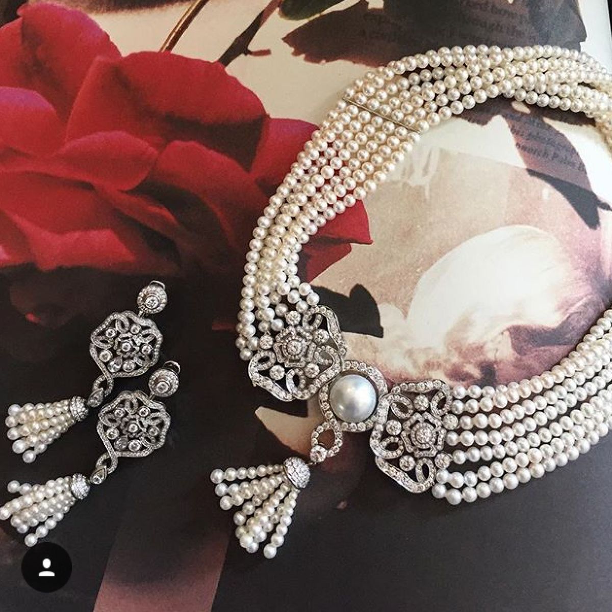 a multi-strand necklace shown with matching earrings