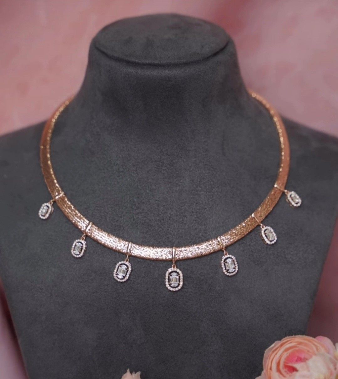 a fine chain with a rectangular center and small hanging drops