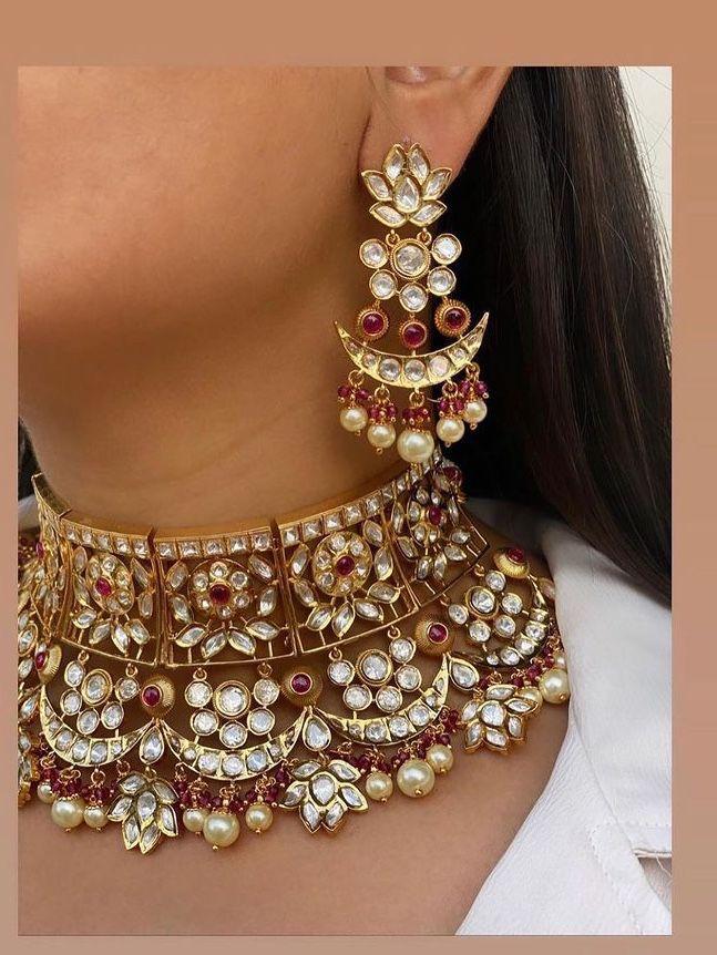 a layered necklace shown with matching earrings