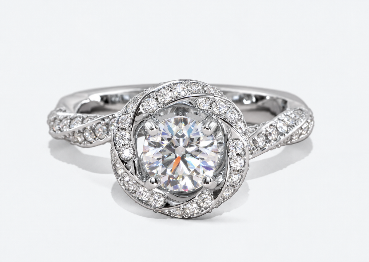 A round centre and circular halo are balanced by interwoven sparkling shoulders.