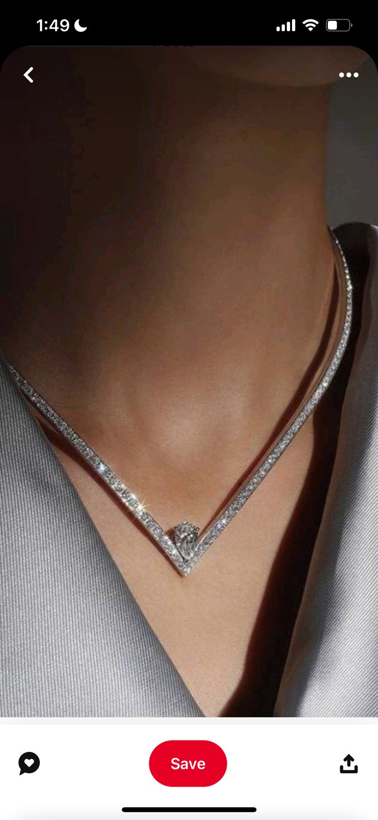 multiple fine chains arranged in a layered V shape