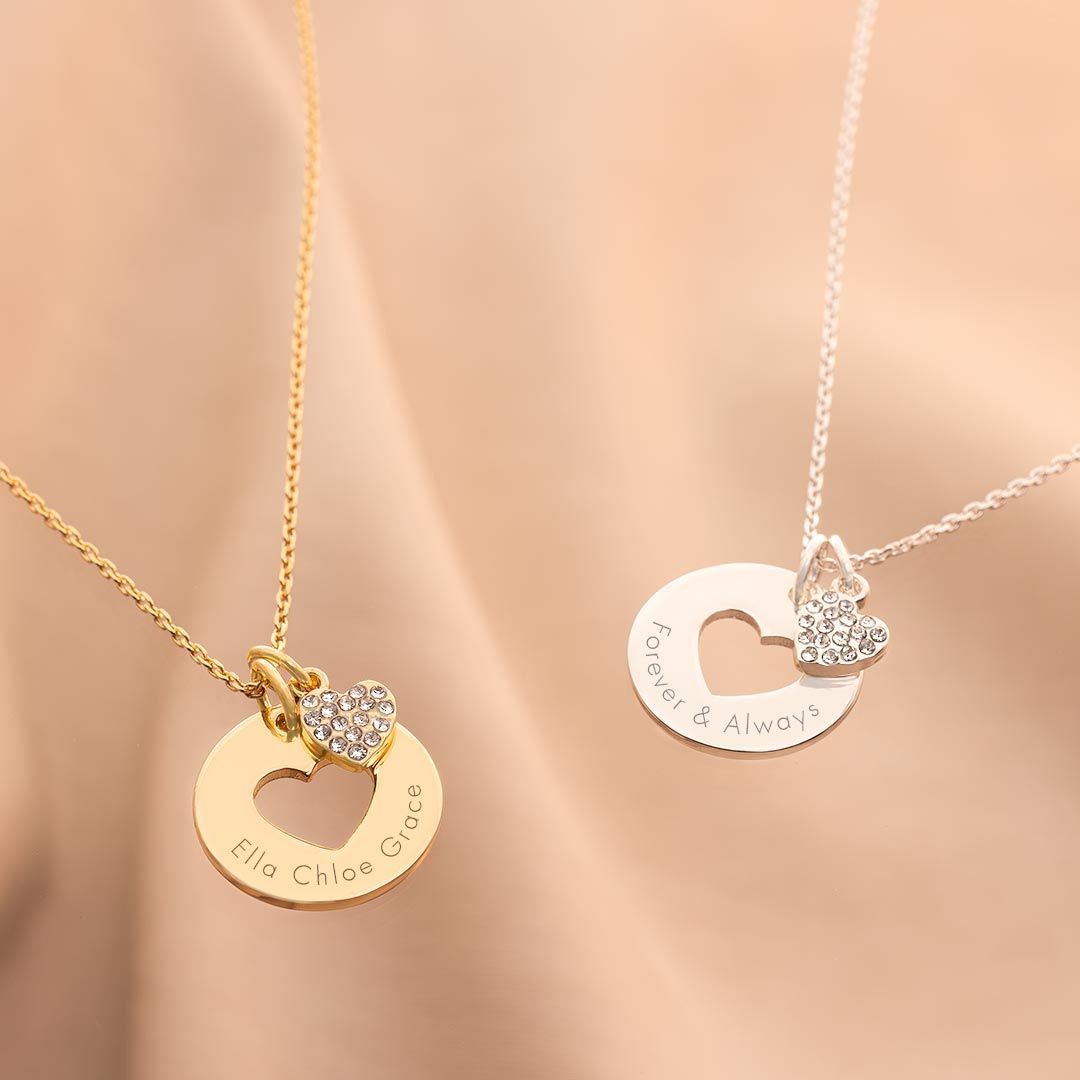 several disc-shaped charms displayed on fine chains