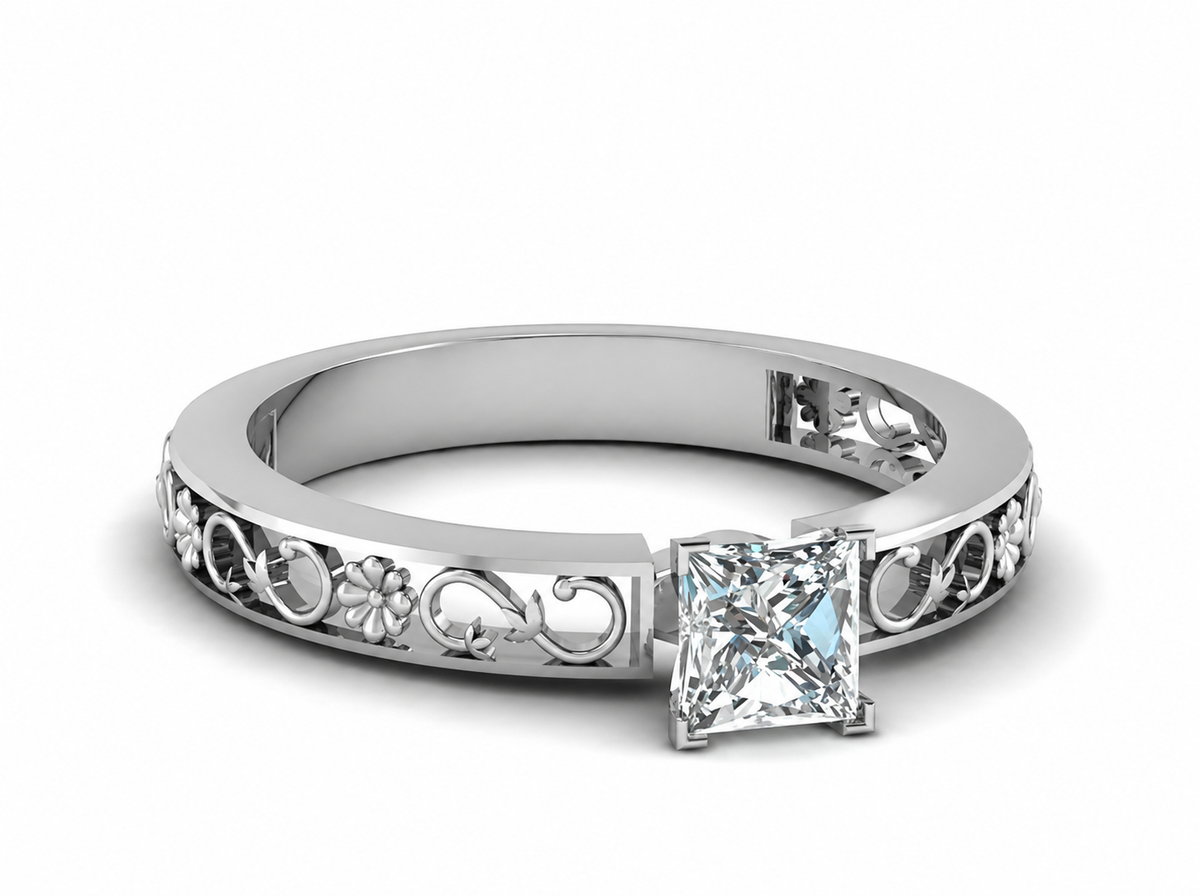 A square clear centre anchors a polished band with airy vine scrolls and flower-like details.