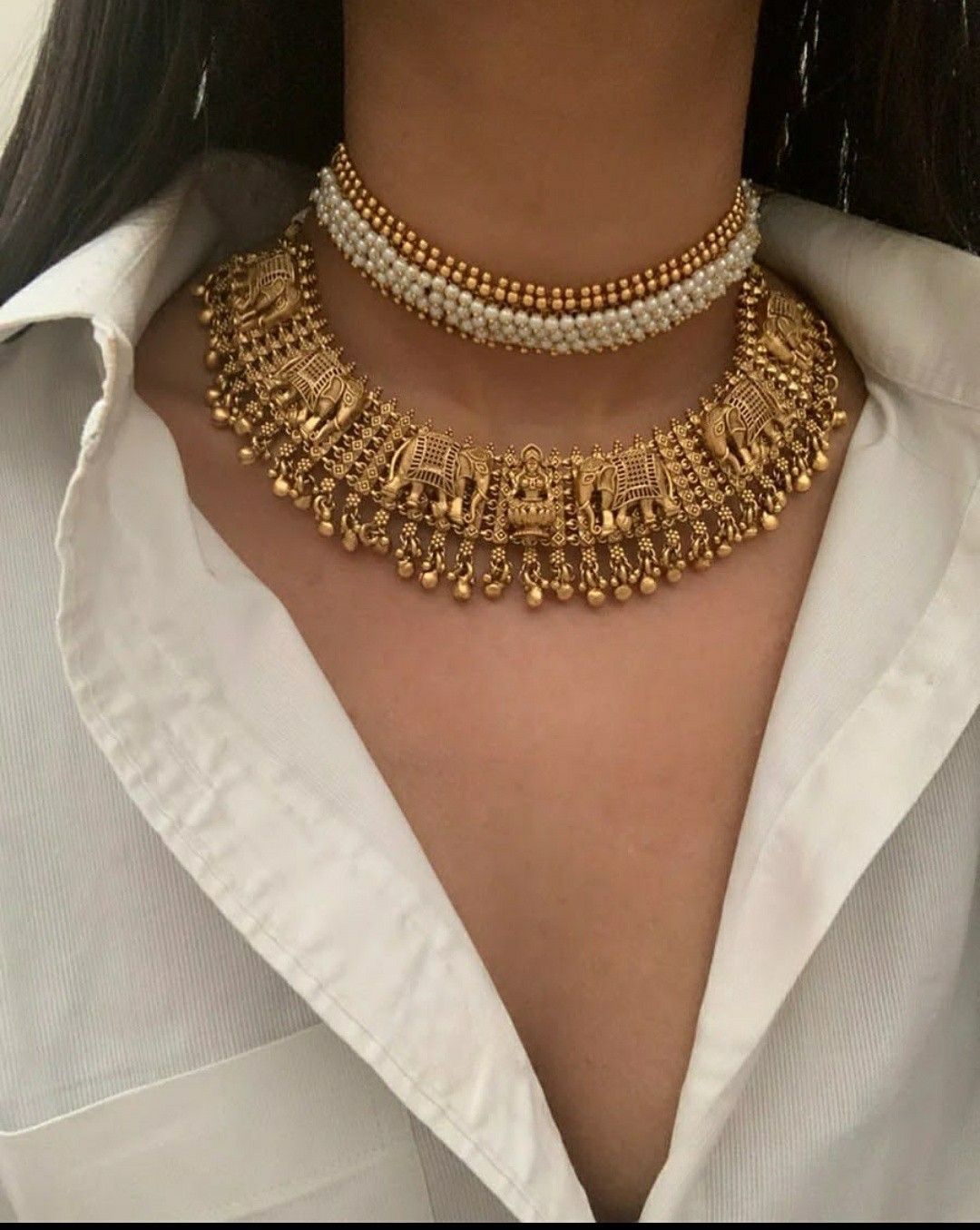 a gold-tone collar with layered hanging details
