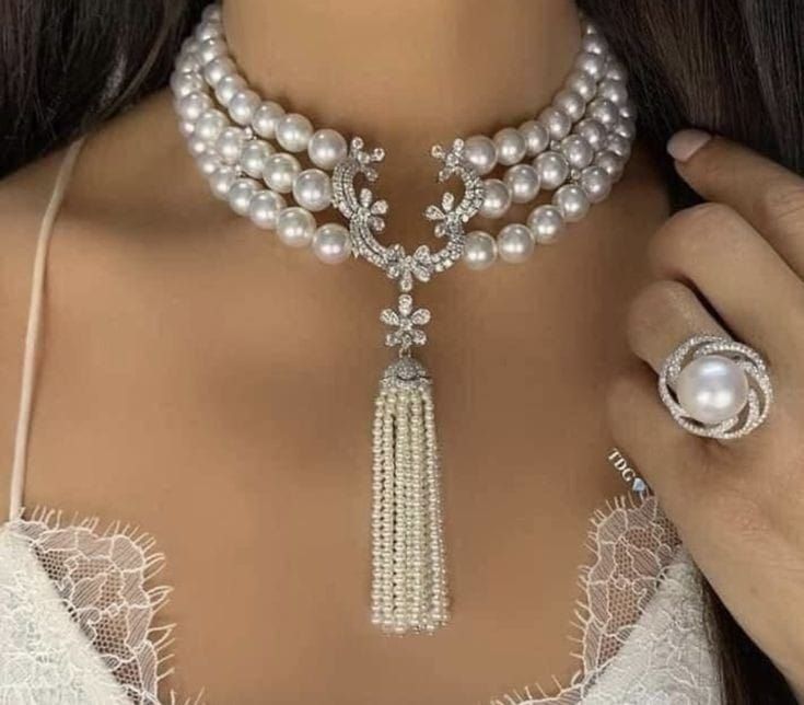 Necklace featuring a curved necklace with a visible focal detail